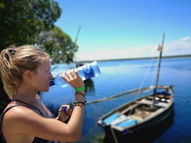 drinking water when paddle boarding