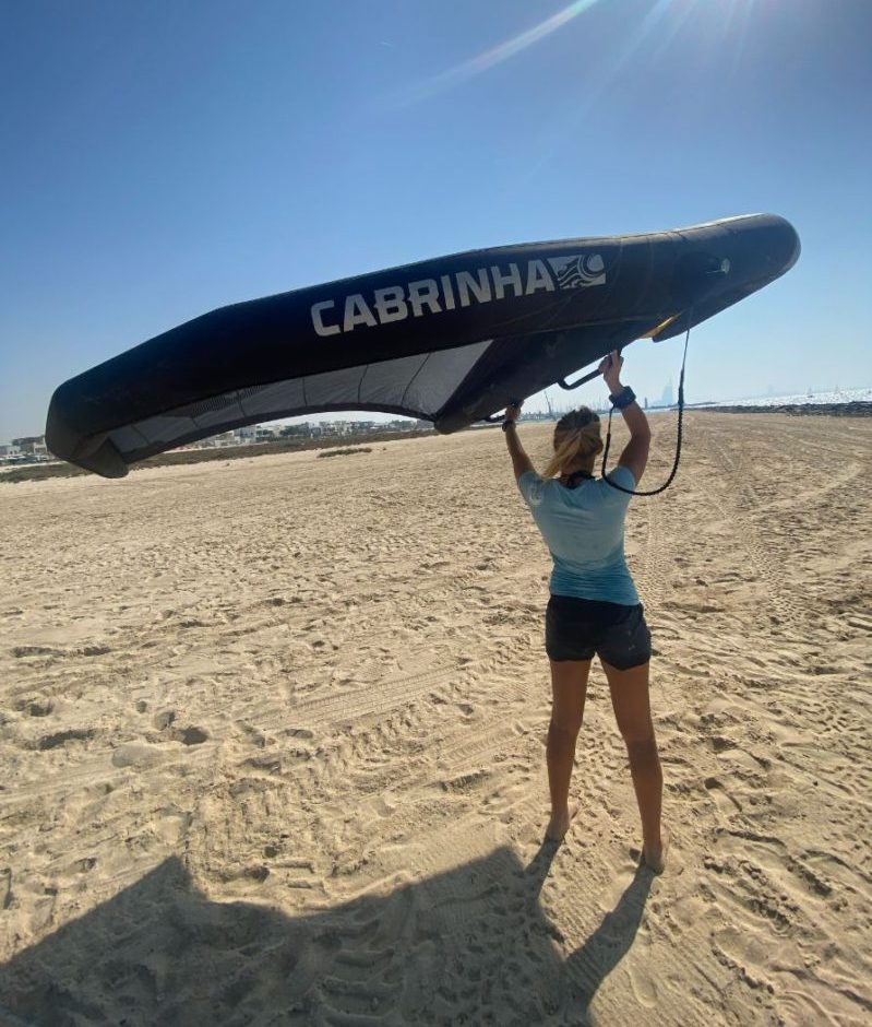 Depowering the wing above the head Wing foil lessons in Dubai