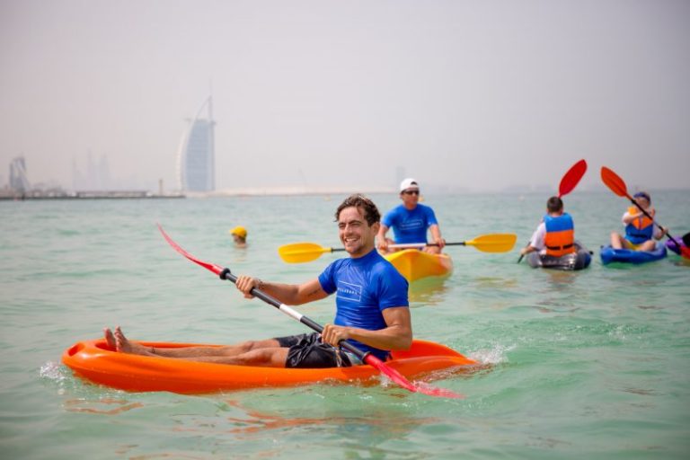 Group paddleboarding in Dubai with Kite N Surf