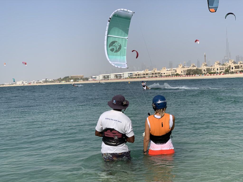 kite surf lessons in Dubai Kite surfing lessons in Dubai with instructors and kitesurfers in action.